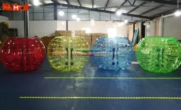 big giant ball with persons inside
